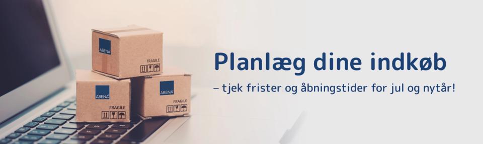 Små papkasser med ABENA-logo, som ligger på en computer.